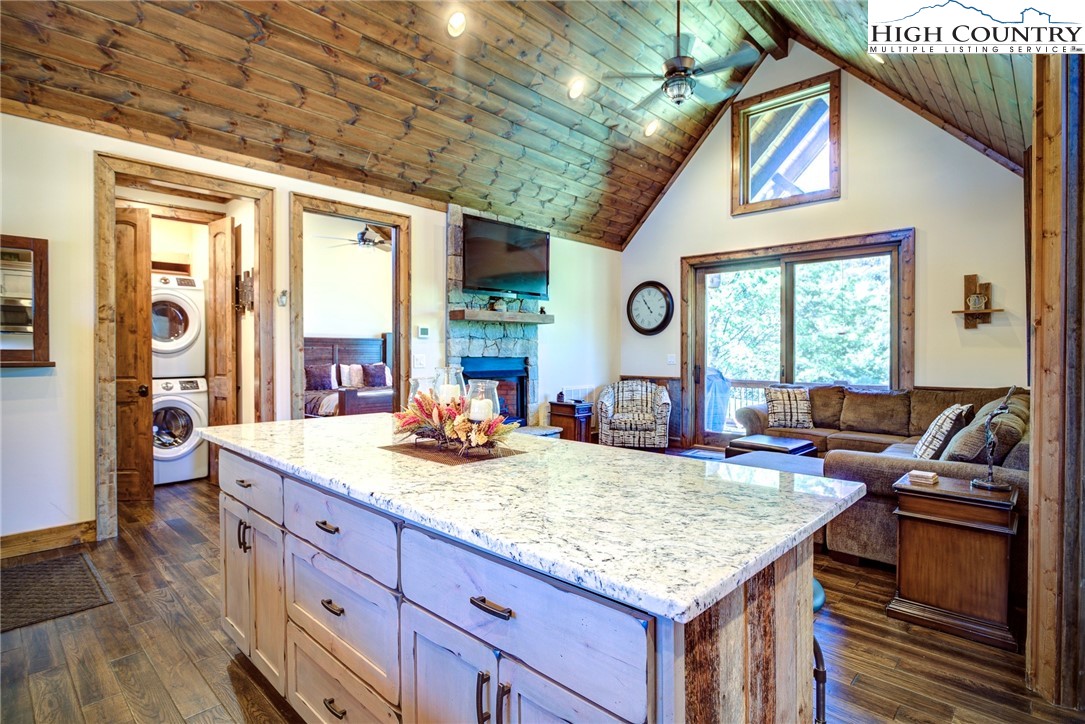 242 Camp Eagle Loop Banner Elk, NC 28604 - Photo 10 of 25 a living room with granite countertop furniture and fireplace