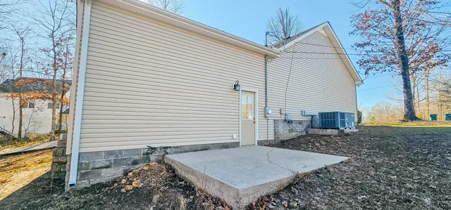 a view of a house with a yard and garage