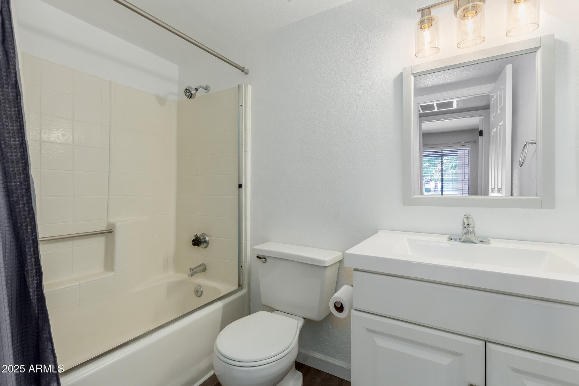 2144 East Center Lane, Unit 3 Tempe, AZ 85281 - Photo 19 of 30 a bathroom with a sink toilet vanity and shower