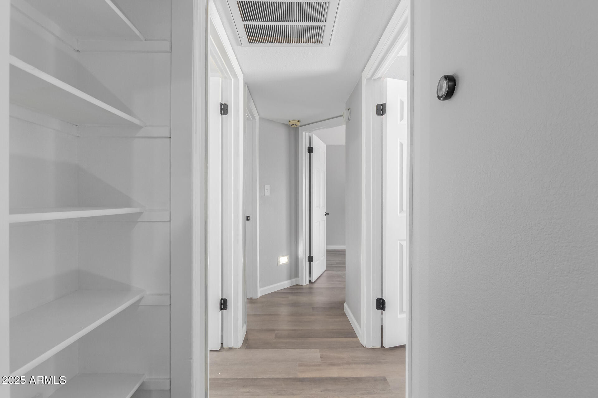 2144 East Center Lane, Unit 3 Tempe, AZ 85281 - Photo 10 of 30 a view of a hallway with wooden floor and staircase