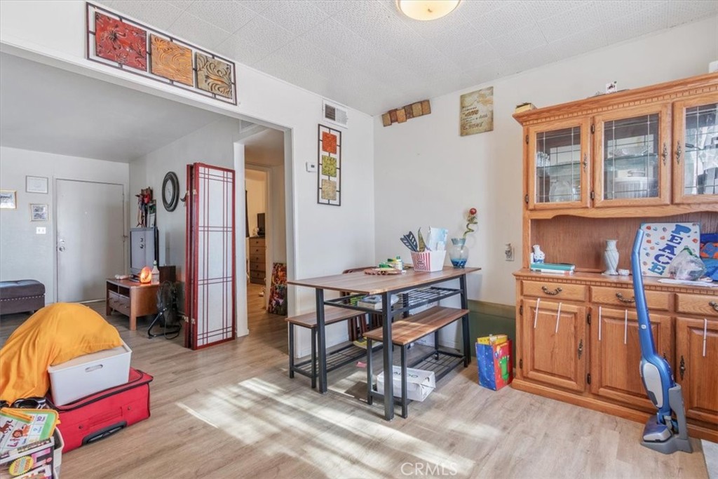 13645 Gilbert Street North Edwards, CA 93523 - Photo 7 of 12 a bedroom with furniture and a workspace