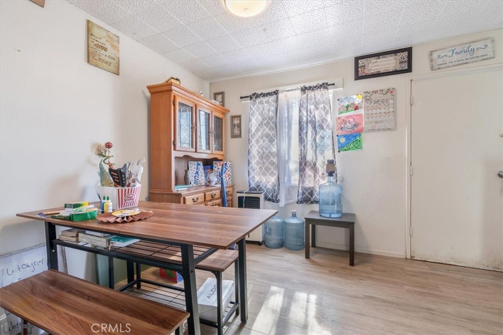 13645 Gilbert Street North Edwards, CA 93523 - Photo 8 of 12 a view of a dining room with furniture and a chandelier