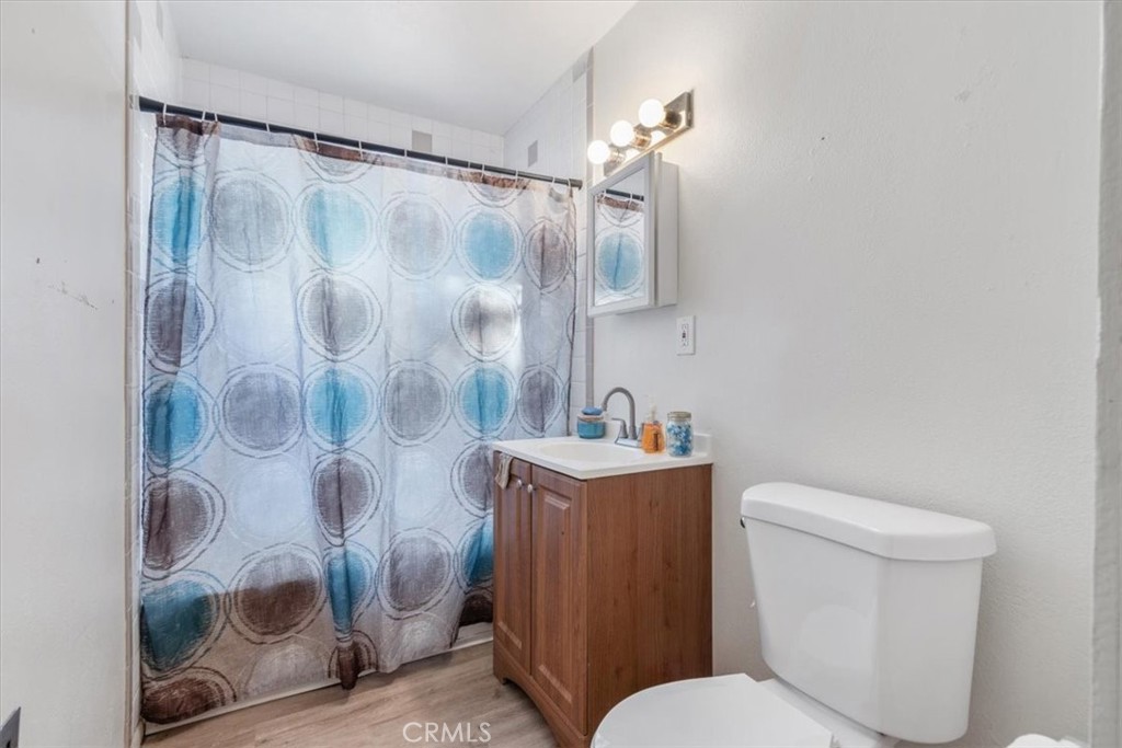 13645 Gilbert Street North Edwards, CA 93523 - Photo 9 of 12 a white toilet sitting next to a bathroom sink