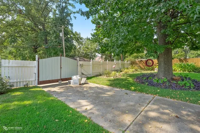 an outdoor space with furniture and garden