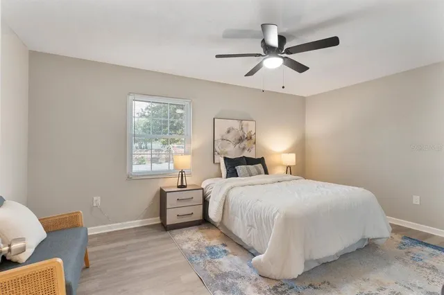 a bedroom with a bed and window