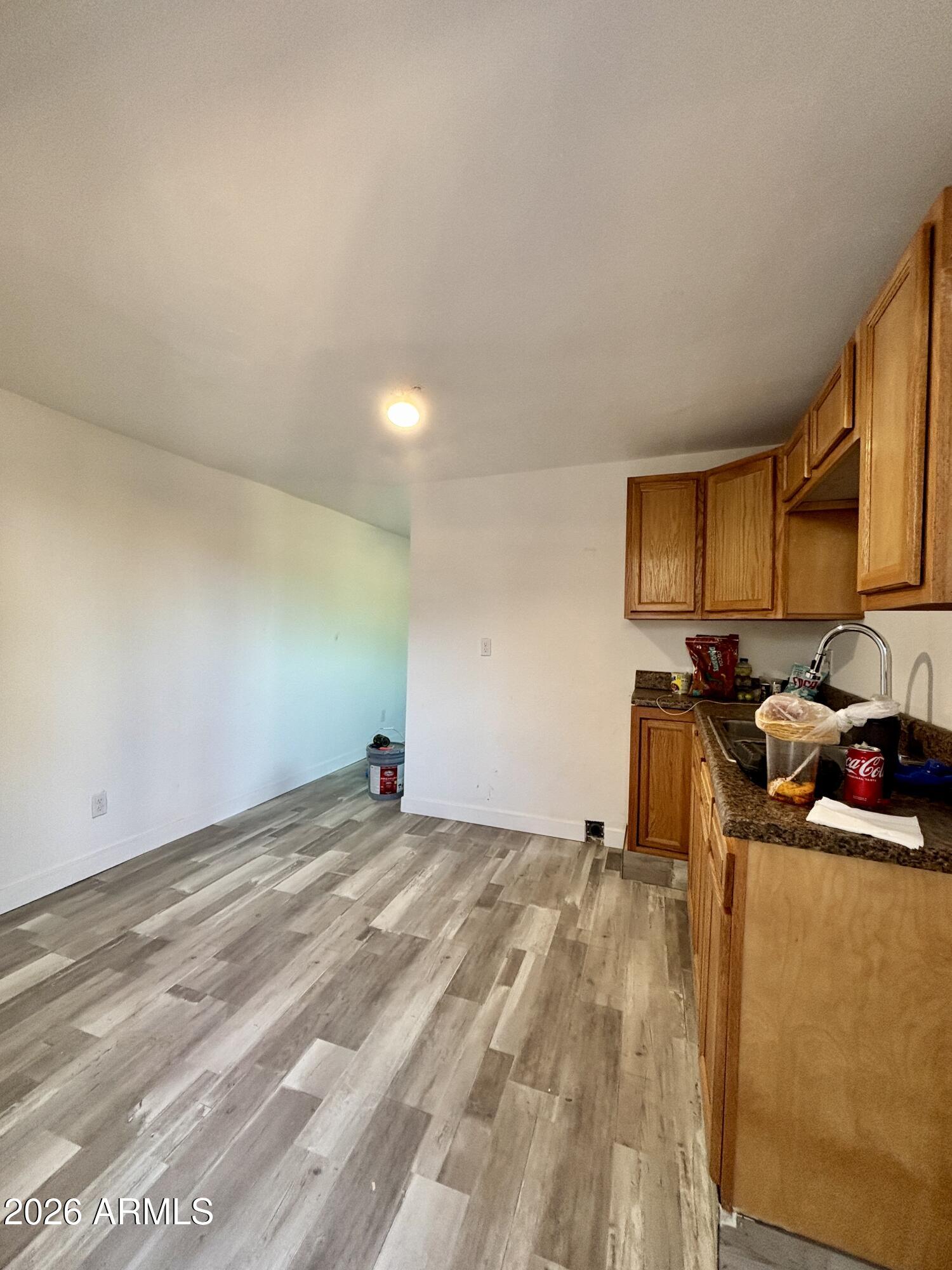 3036 West Almeria Road Phoenix, AZ 85009 - Photo 7 of 18 a view of a kitchen with a sink and cabinets