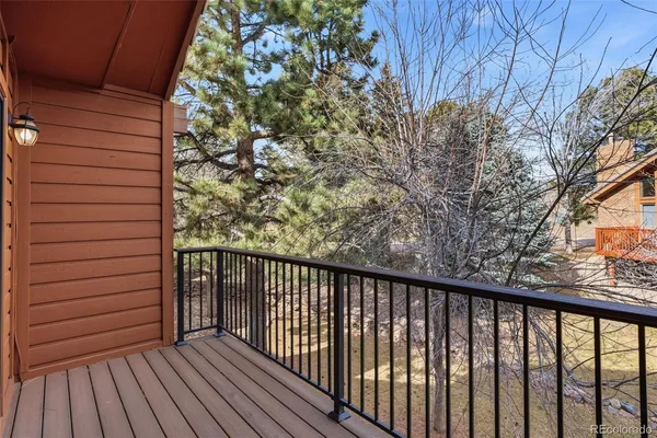 a view of a balcony with wooden floor