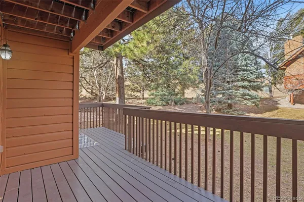a view of a balcony with wooden floor