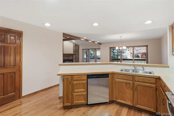 a kitchen with sink and cabinets