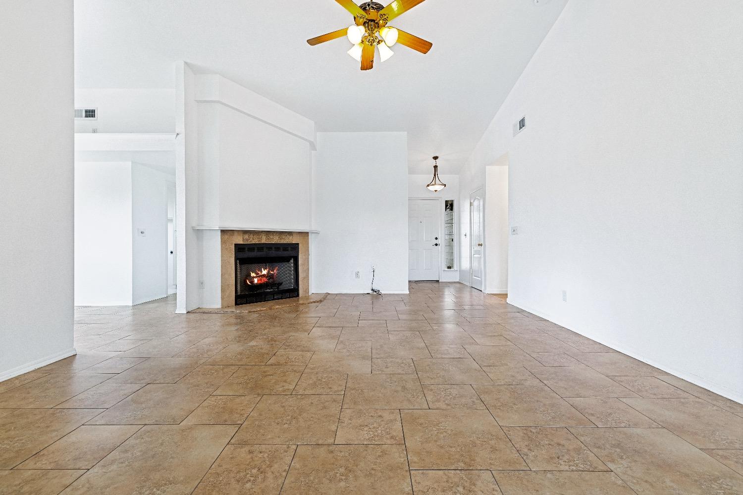 21596 Road 30 Madera, CA 93638 - Photo 16 of 57 a view of an empty room with a fireplace
