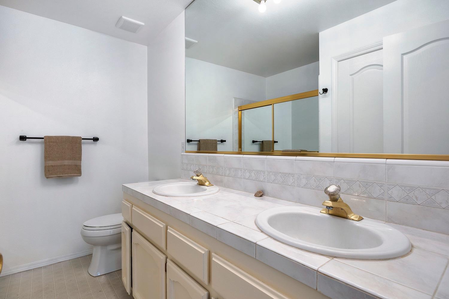 21596 Road 30 Madera, CA 93638 - Photo 35 of 57 a bathroom with a sink and a toilet
