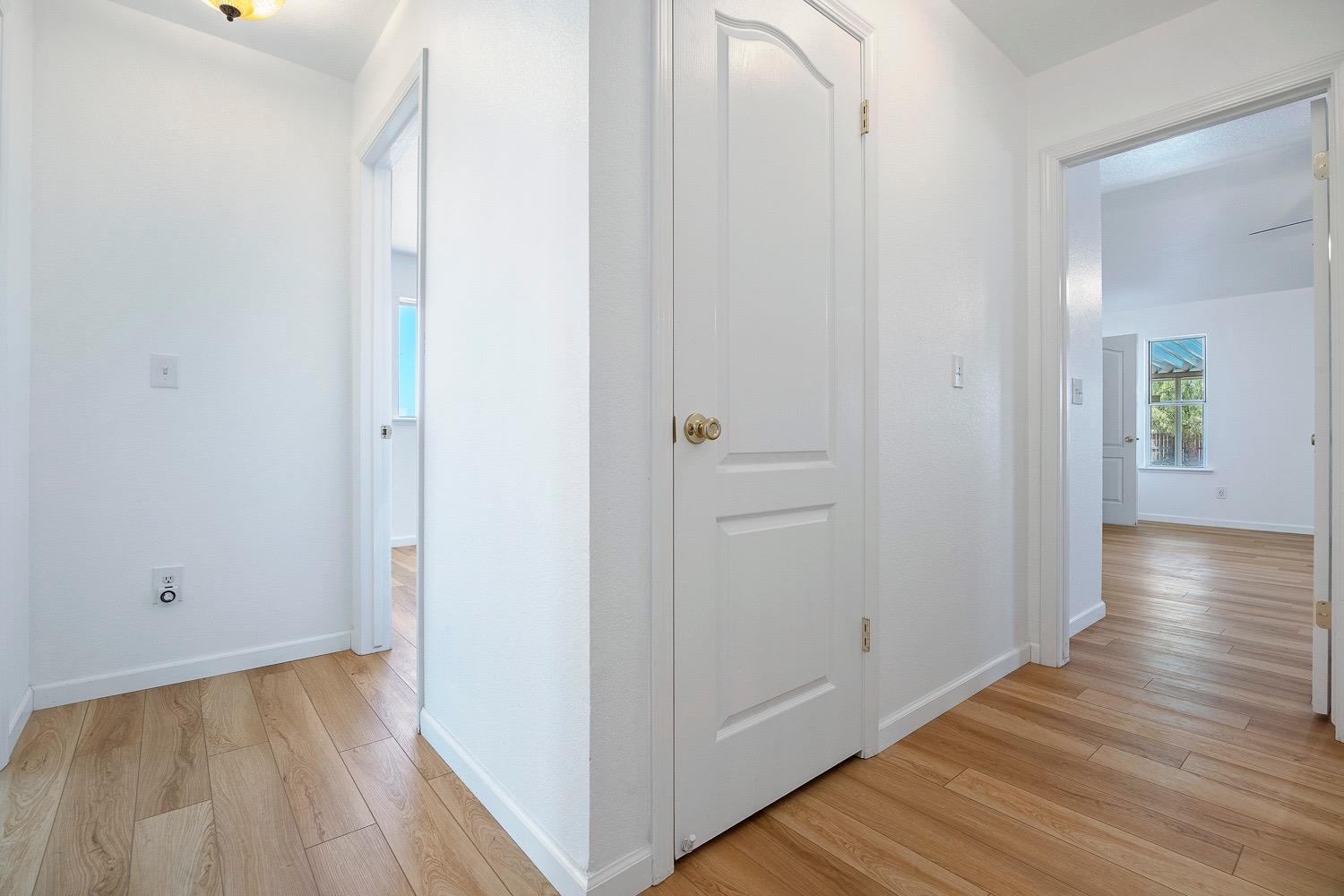 21596 Road 30 Madera, CA 93638 - Photo 38 of 57 a view of a hallway with wooden floor