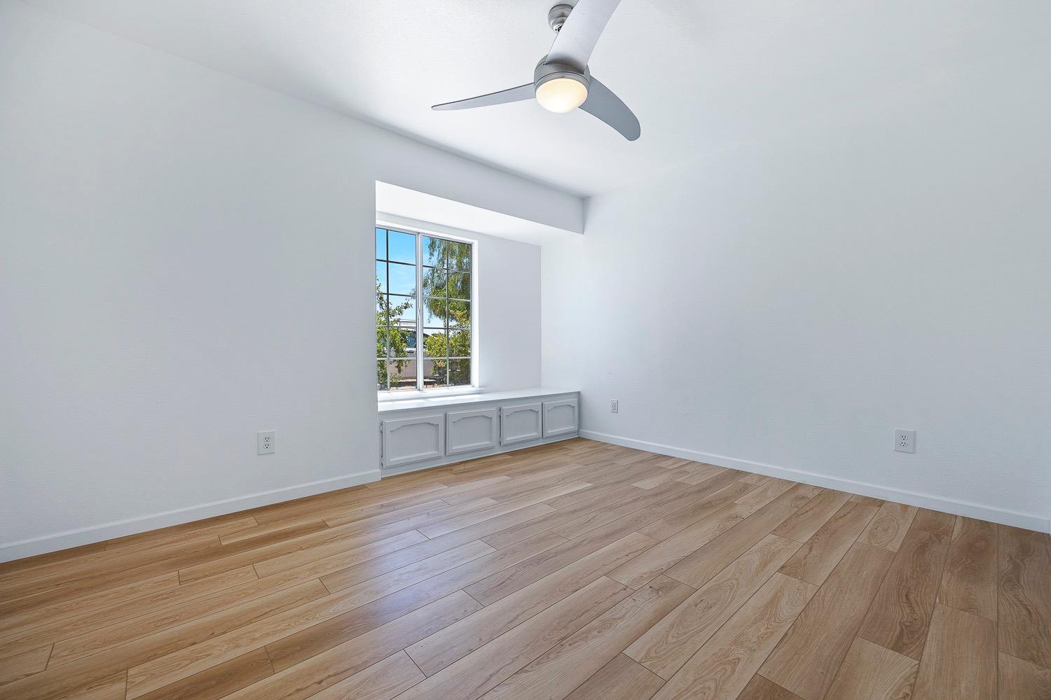 21596 Road 30 Madera, CA 93638 - Photo 39 of 57 wooden floor in an empty room with a window