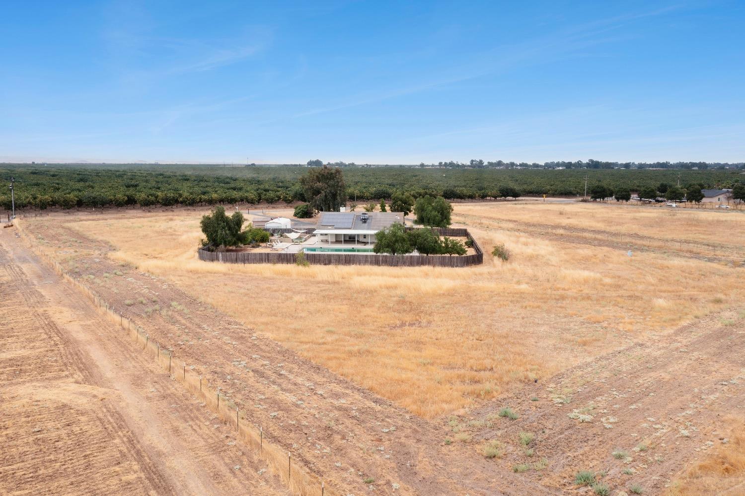 21596 Road 30 Madera, CA 93638 - Photo 4 of 57 a view of a lake with houses in the back