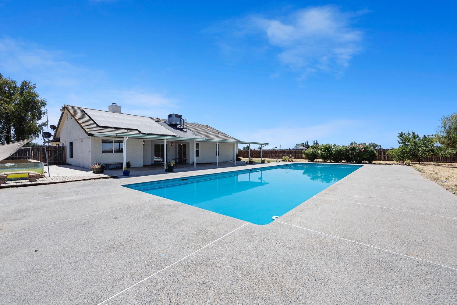21596 Road 30 Madera, CA 93638 - Photo 50 of 57 a front view of a house with a yard