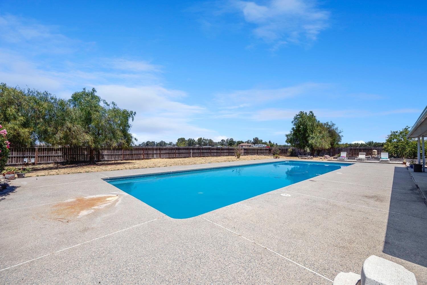 21596 Road 30 Madera, CA 93638 - Photo 52 of 57 a view of an outdoor space and swimming pool
