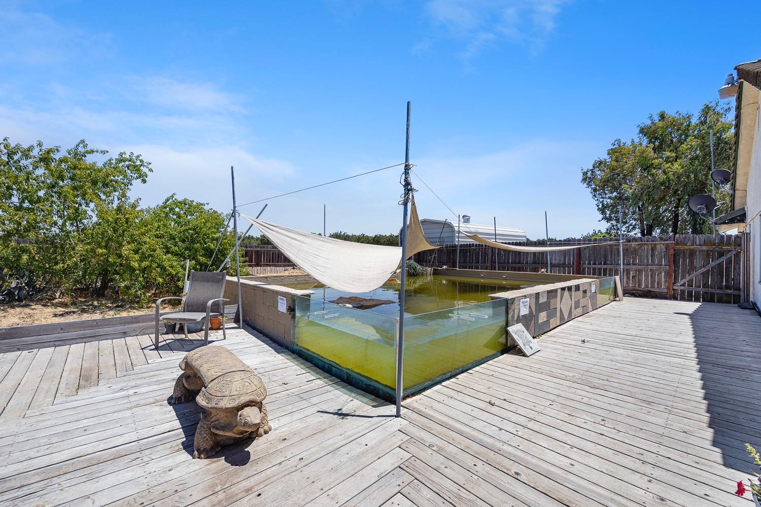 21596 Road 30 Madera, CA 93638 - Photo 54 of 57 a view of a wooden deck with a bench