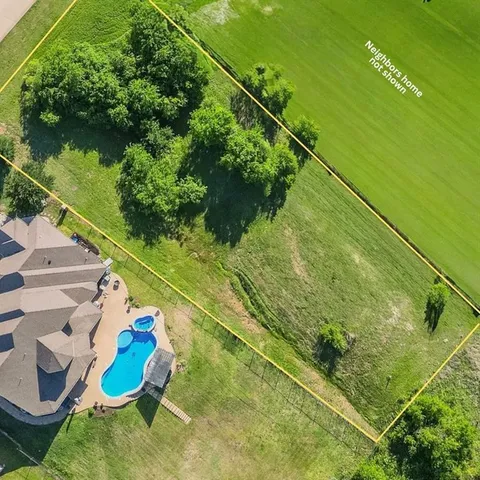 a backyard of a house with lots of green space