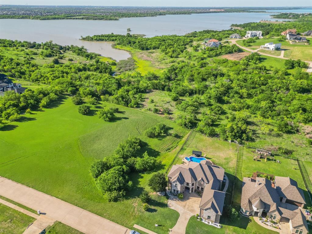 3248 Koscher Drive Grand Prairie, TX 75104 - Photo 19 of 26 a view of a garden with a lake