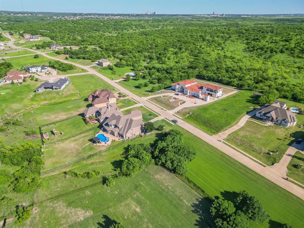 3248 Koscher Drive Grand Prairie, TX 75104 - Photo 2 of 26 an aerial view of a golf course with parking space