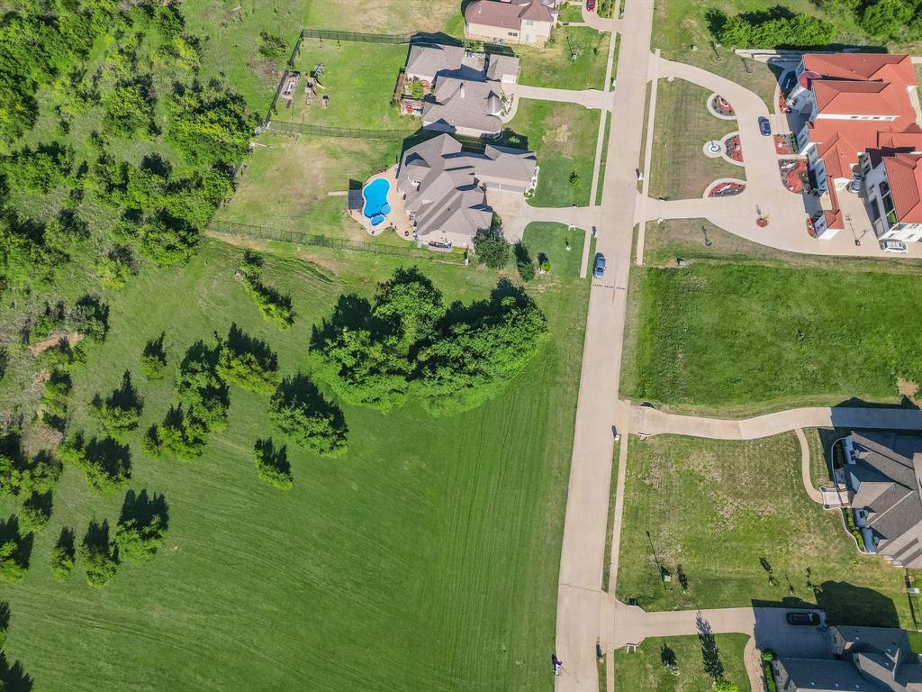 3248 Koscher Drive Grand Prairie, TX 75104 - Photo 9 of 26 an aerial view of a house with a garden