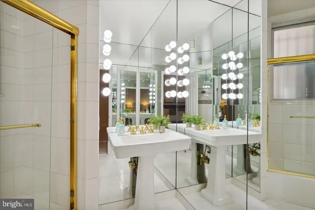 a view of a dining room with furniture a chandelier and window
