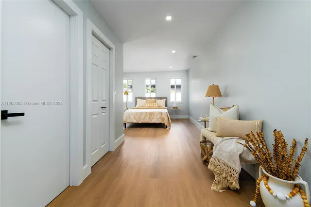 a bedroom with furniture and a wooden floor