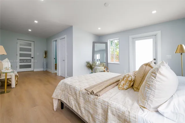 a bedroom with a bed and a chair