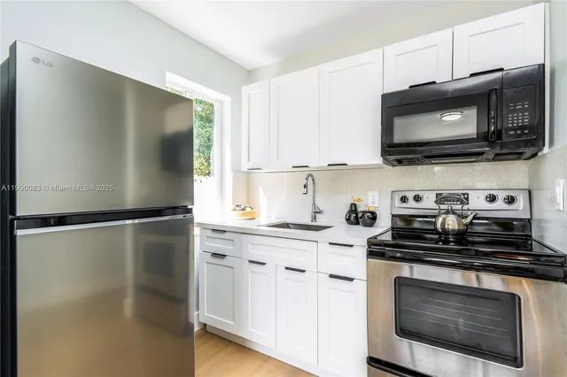 a kitchen with a stove and a microwave