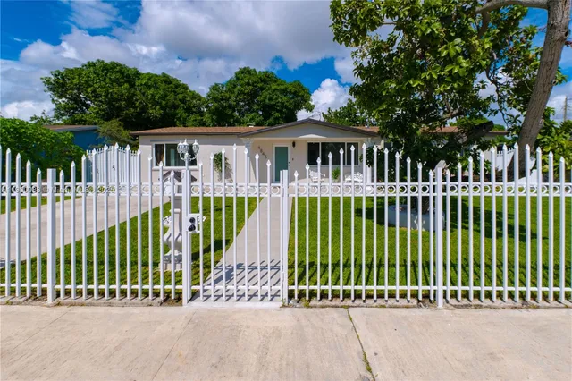 a view of a house with a garden area
