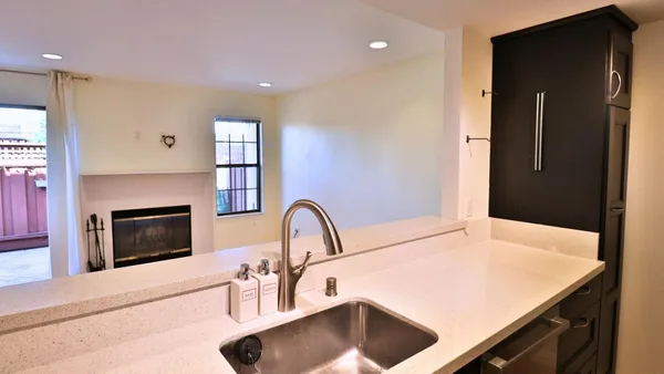 a kitchen with a sink and a refrigerator