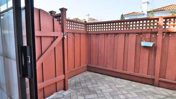 a view of a wooden door with a outdoor space