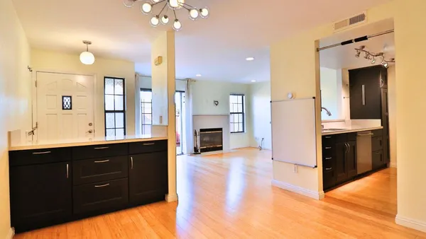 a view of a kitchen cabinets and a wooden floor