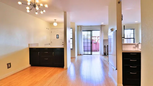 a spacious bathroom with a granite countertop sink mirror and shower