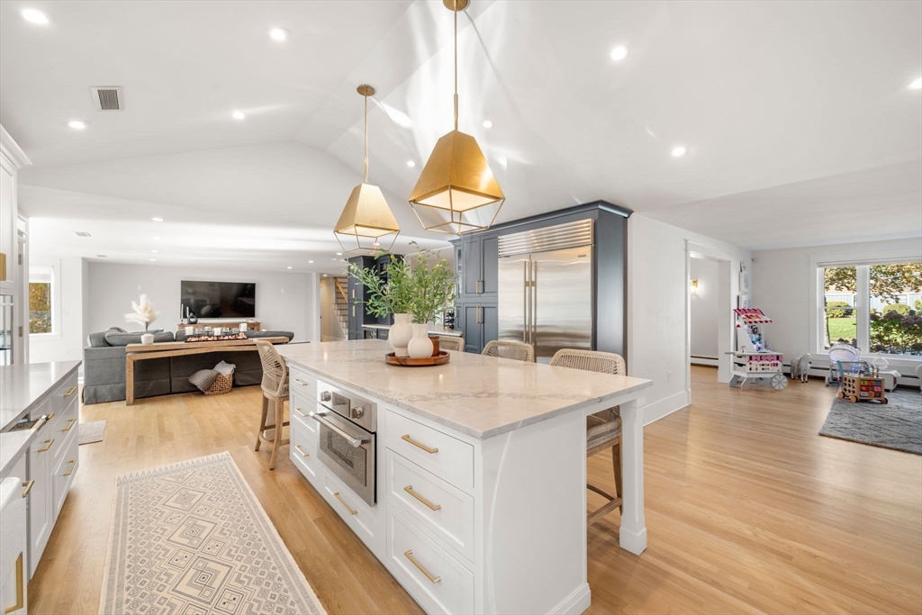 23 Tophet Road Lynnfield, MA 01940 - Photo 11 of 42 a kitchen with a stove and a wooden floors