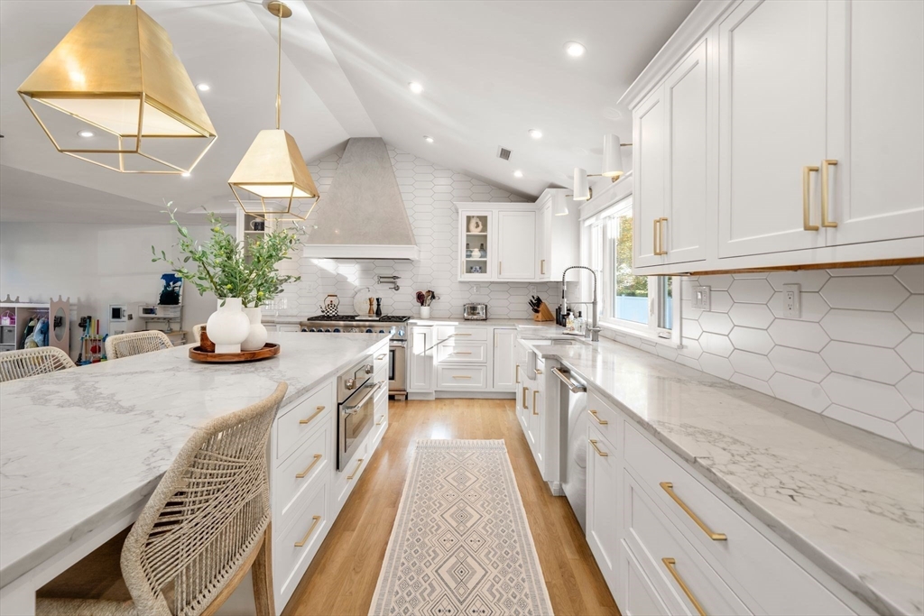 23 Tophet Road Lynnfield, MA 01940 - Photo 12 of 42 a large kitchen with stainless steel appliances granite countertop a lot of counter space and a sink
