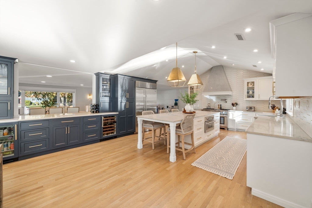 23 Tophet Road Lynnfield, MA 01940 - Photo 15 of 42 a large kitchen with a lot of counter space and a wooden floor