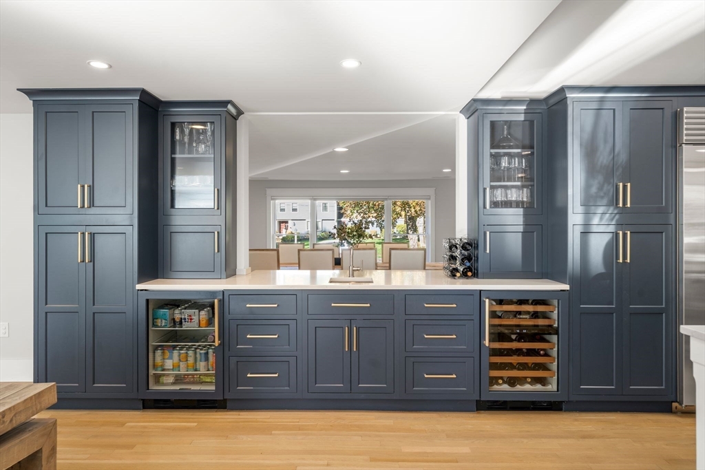 23 Tophet Road Lynnfield, MA 01940 - Photo 16 of 42 a kitchen with stainless steel appliances granite countertop a refrigerator and wooden cabinets