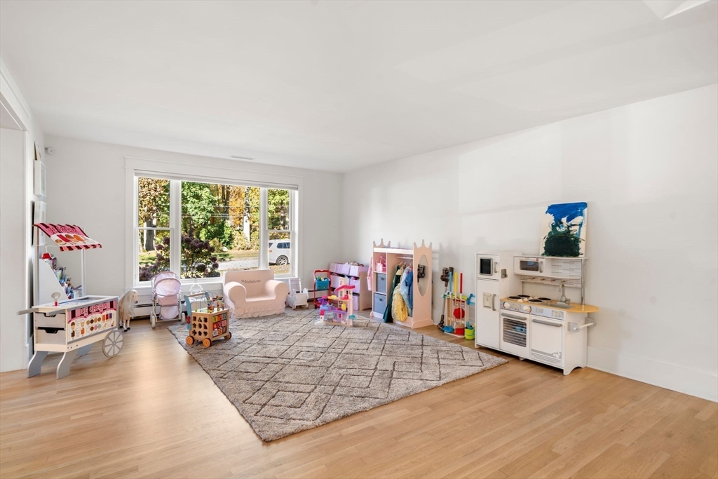 23 Tophet Road Lynnfield, MA 01940 - Photo 19 of 42 a bedroom with furniture and a large window