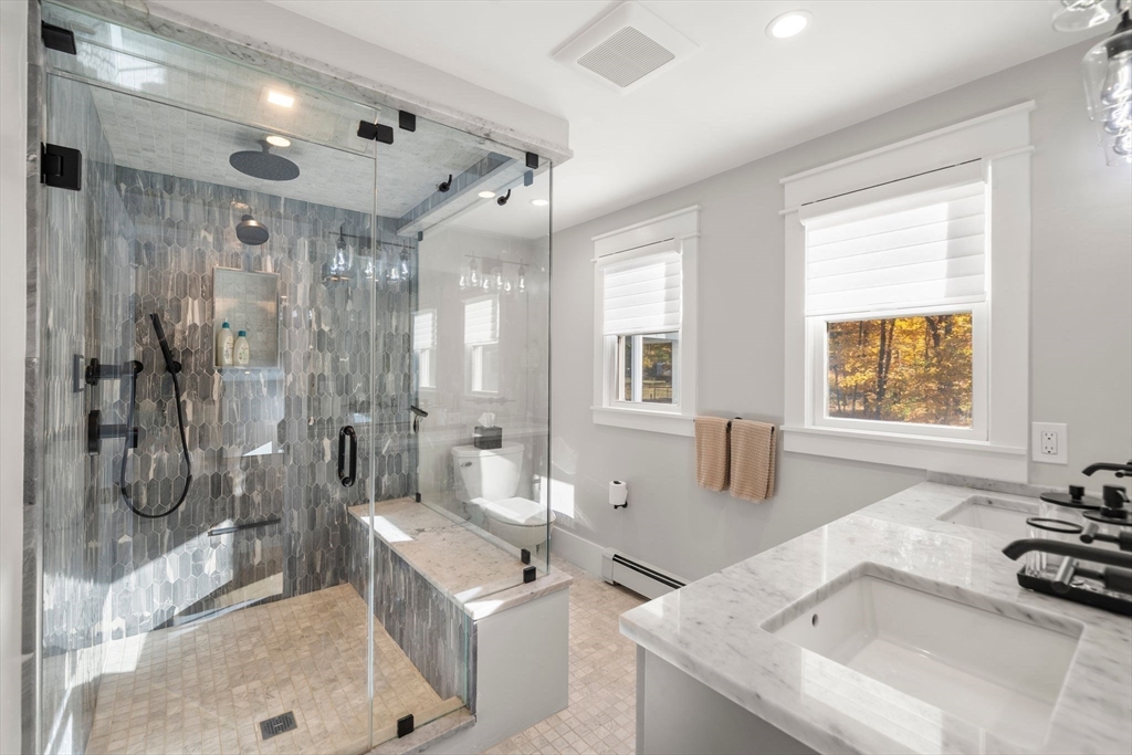 23 Tophet Road Lynnfield, MA 01940 - Photo 24 of 42 a spacious bathroom with a tub sink shower and mirror