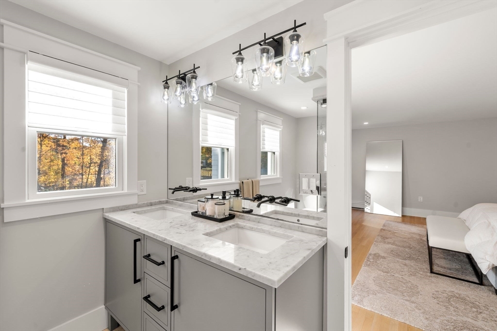 23 Tophet Road Lynnfield, MA 01940 - Photo 25 of 42 a bathroom with a sink vanity and a mirror
