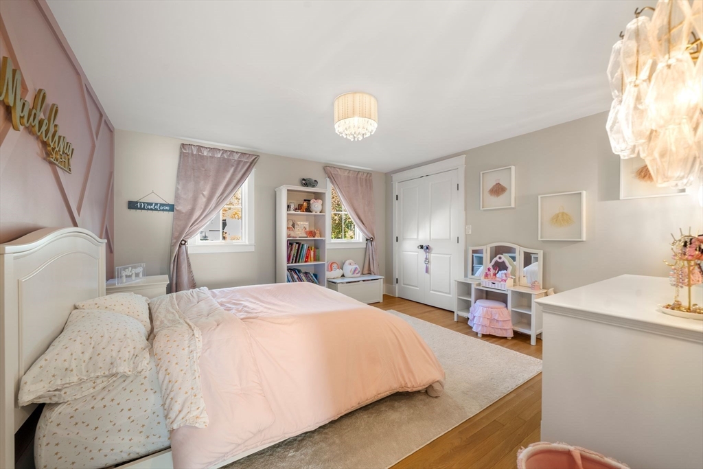 23 Tophet Road Lynnfield, MA 01940 - Photo 26 of 42 a bedroom with a bed and a dresser next to a window