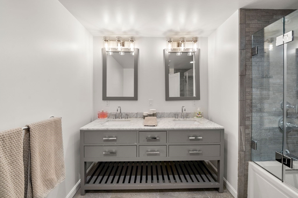 23 Tophet Road Lynnfield, MA 01940 - Photo 29 of 42 a bathroom with a sink and a mirror