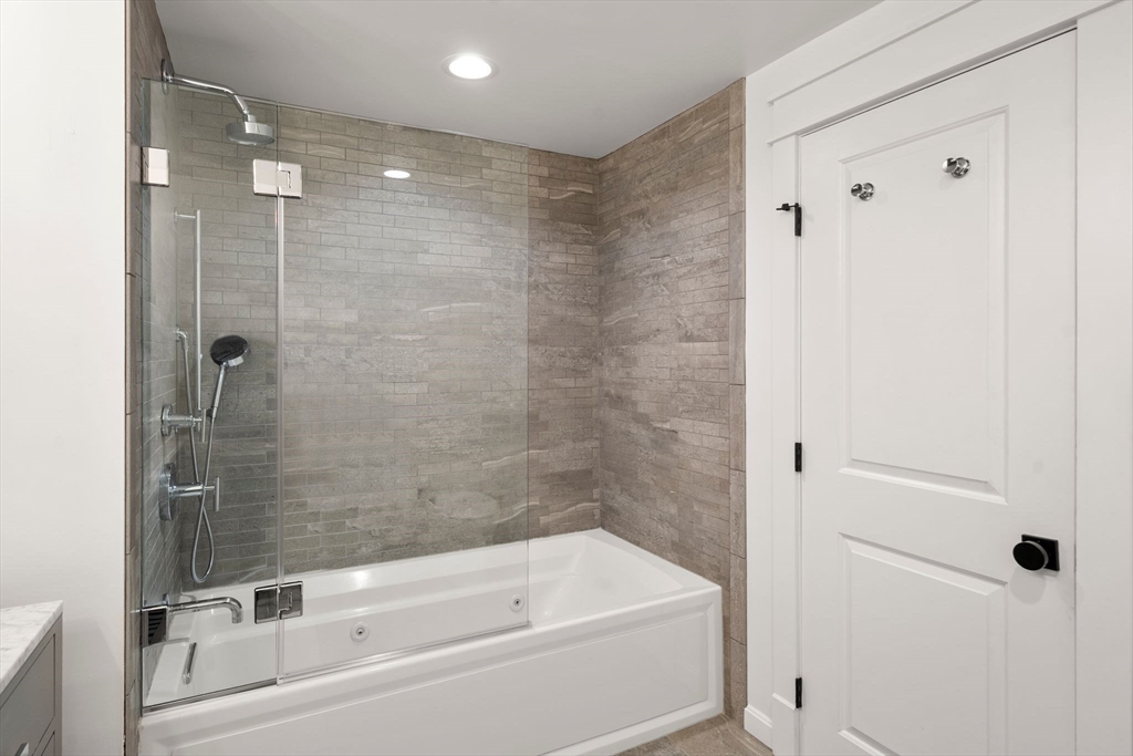 23 Tophet Road Lynnfield, MA 01940 - Photo 30 of 42 a bathroom with a bathtub and a shower