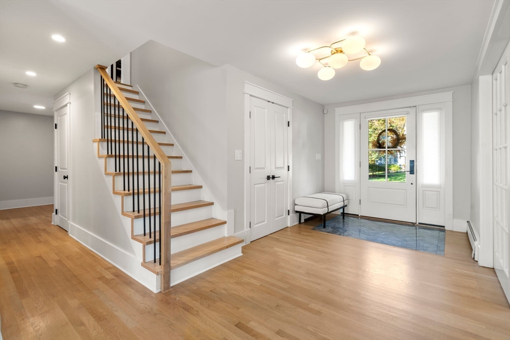 23 Tophet Road Lynnfield, MA 01940 - Photo 3 of 42 an entryway with a workspace wooden floor and windows
