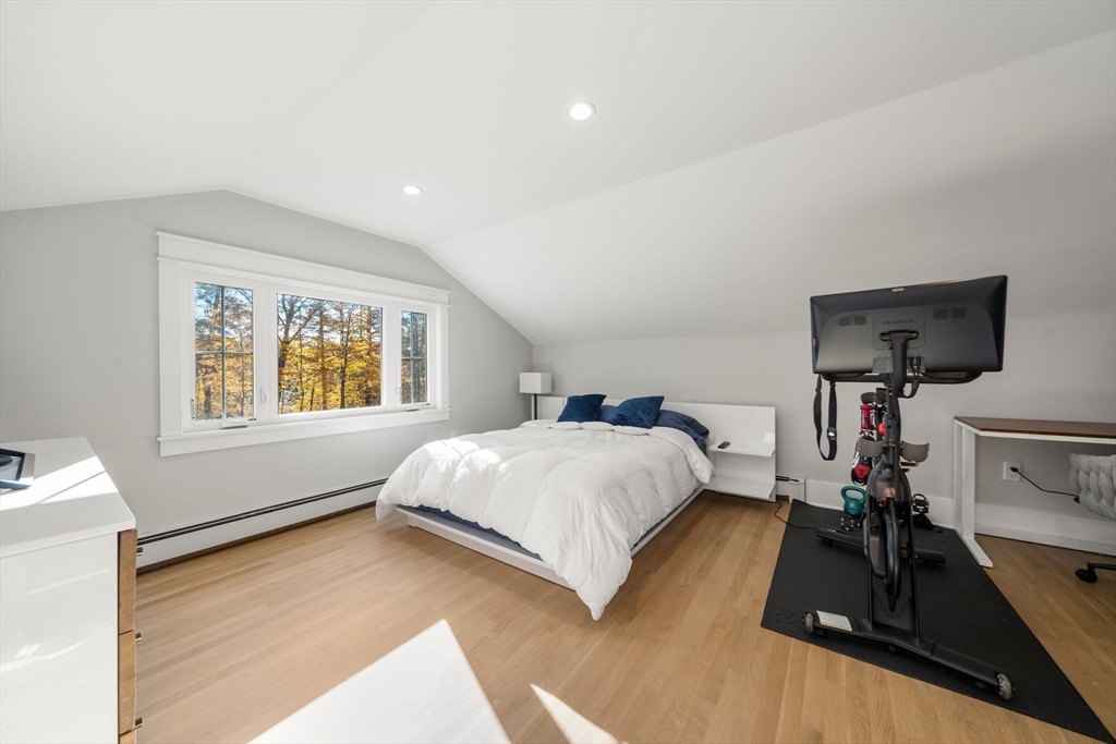 23 Tophet Road Lynnfield, MA 01940 - Photo 31 of 42 a bedroom with a bed and a flat tv screen on the dresser