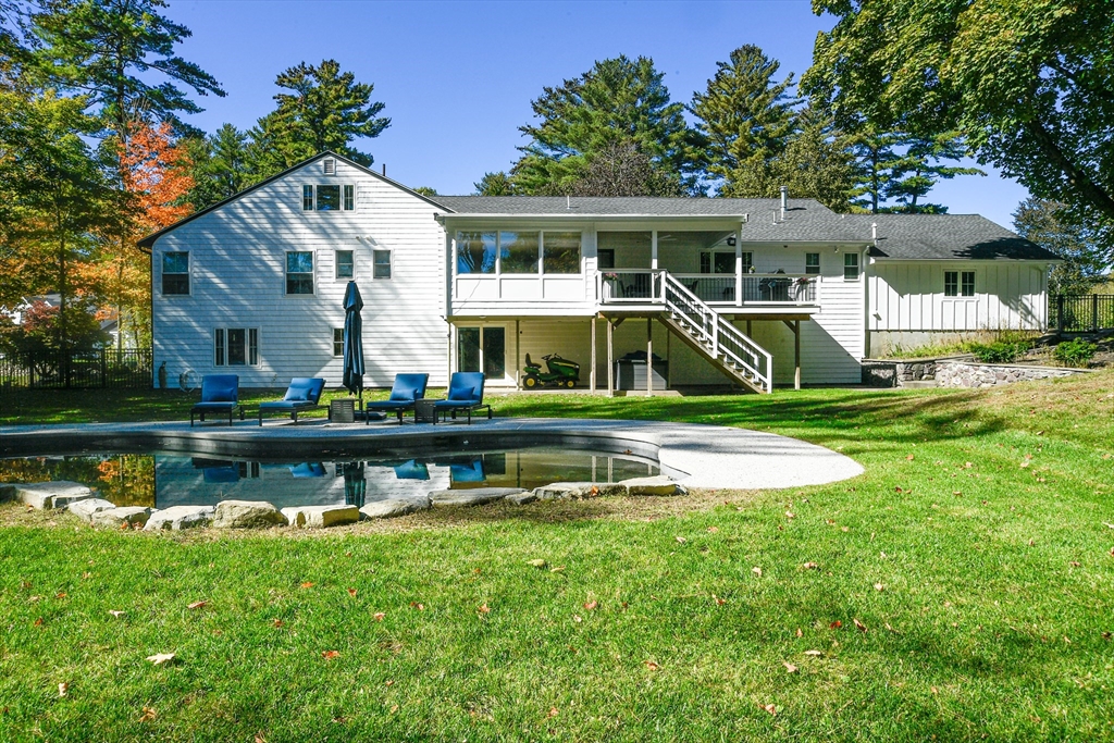 23 Tophet Road Lynnfield, MA 01940 - Photo 40 of 42 a front view of a house with a yard table and chairs