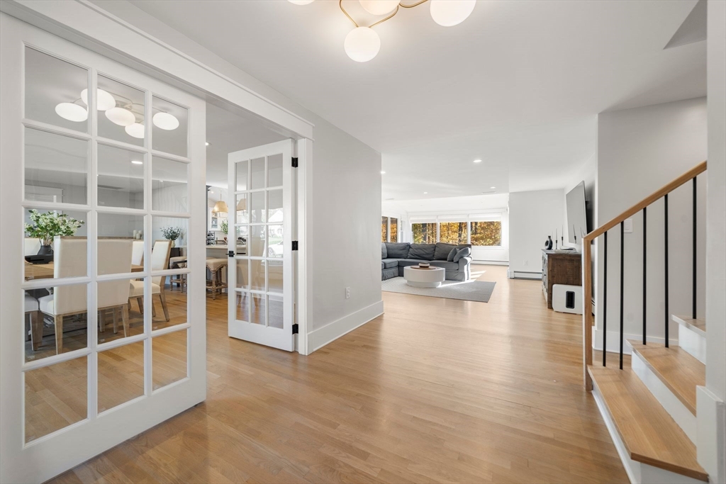 23 Tophet Road Lynnfield, MA 01940 - Photo 4 of 42 a view of a living room and a livingroom with furniture wooden floor and a large window