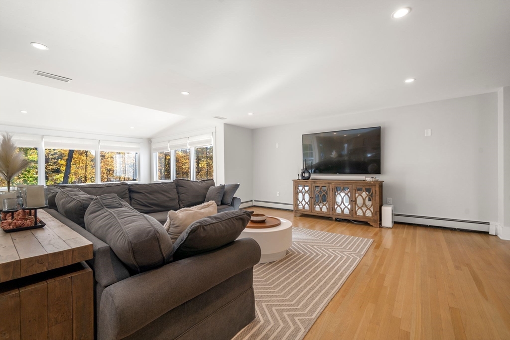 23 Tophet Road Lynnfield, MA 01940 - Photo 6 of 42 a living room with furniture and a flat screen tv