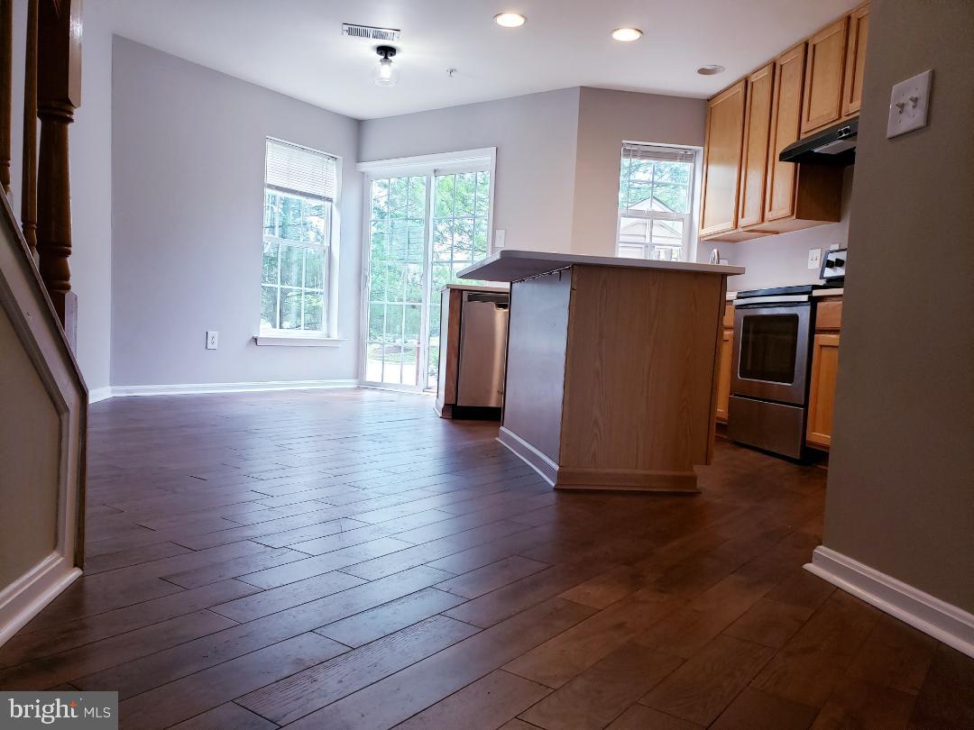 613 Tivoli Road Frederick, MD 21703 - Photo 8 of 23 Kitchen and breakfast nook brand new wood floors